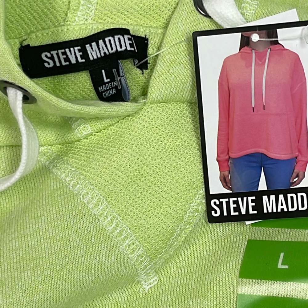 Brand new with tags Woman’s Steve Madden hooded sweatshirt. Size Large.